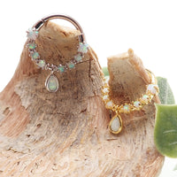 Gold steel Opal Tear Drop Septum Body Jewelry by Body Clickers, 16g steel clicker with 8mm tear drop opal design.