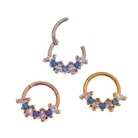 Blue opal and clear CZ surgical steel clicker body jewelry in 16g with gold accents, designed for body piercing.