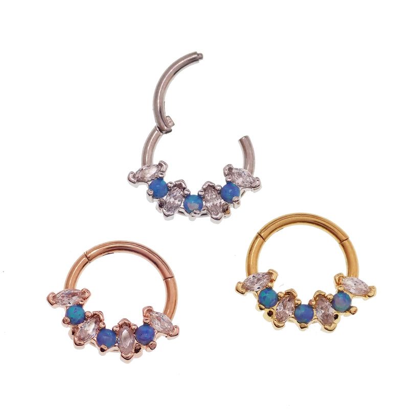 Blue opal and clear CZ surgical steel clicker body jewelry in 16g with gold accents, designed for body piercing.