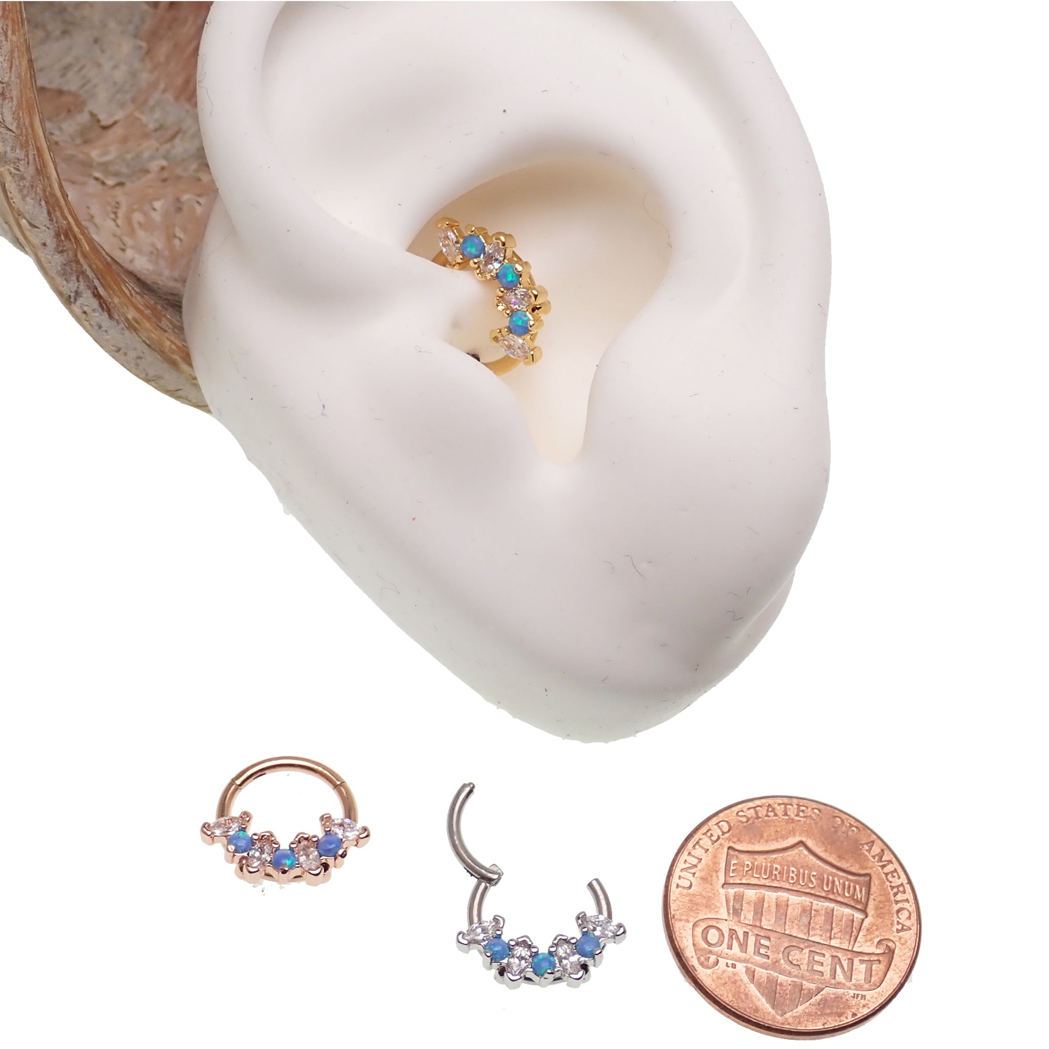Blue opal and clear CZ surgical steel clicker body jewelry in 16g with gold accents, designed for body piercing.