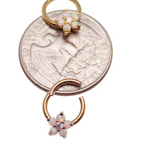 Gold Flower Opal Clicker Hoop 8mm 16g by Body Clickers Body Jewelry, featuring a floral design and colorful opal accents.