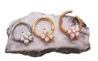 Gold Flower Opal Clicker Hoop earring, 8mm diameter, 16g body jewelry with floral design and opal accent.