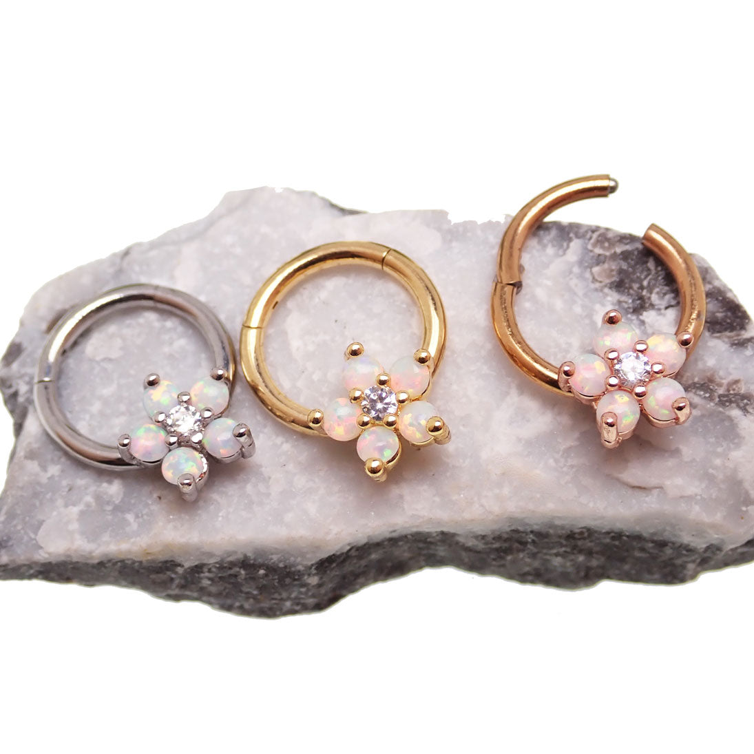 Gold Flower Opal Clicker Hoop 8mm 16g by Body Clickers Body Jewelry featuring a floral design and vibrant opal accents.