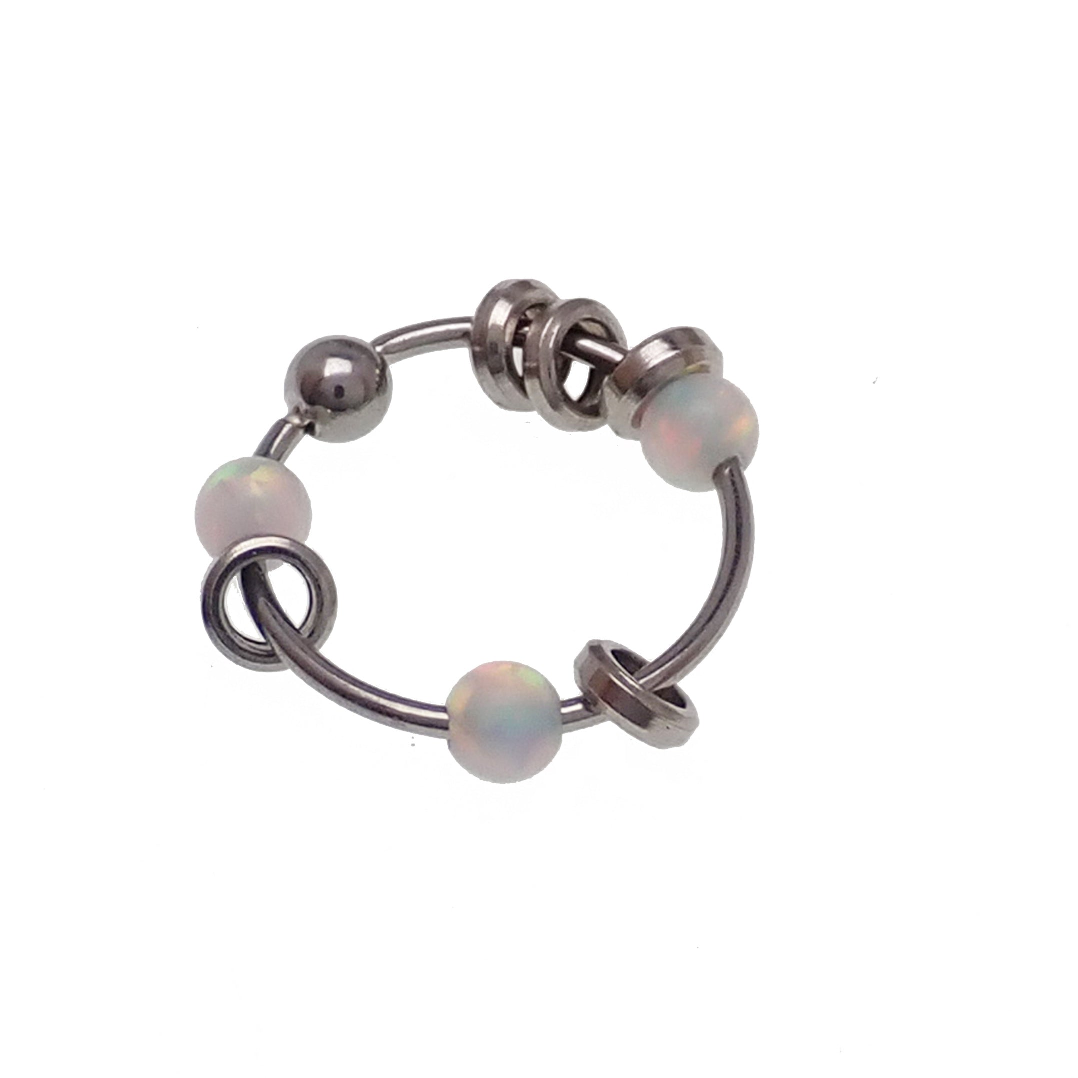 Steel body jewelry ring with assorted attachments, 22g, by Body Clickers, featuring a green 8mm steel ring with decorative elements.