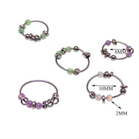 Green steel body jewelry ring with assorted attachments, 22g, by Body Clickers, featuring a durable 8mm body piercing design.