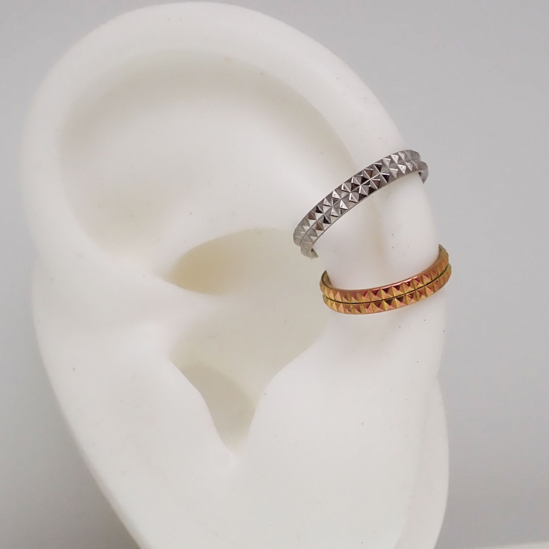 Hinged engraved double row clicker body jewelry in 16g with 8mm size, featuring intricate engraved design on shiny metal.