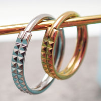 Hinged engraved double row clicker body jewelry in 16g with 8mm width, featuring detailed engraving and sleek design.