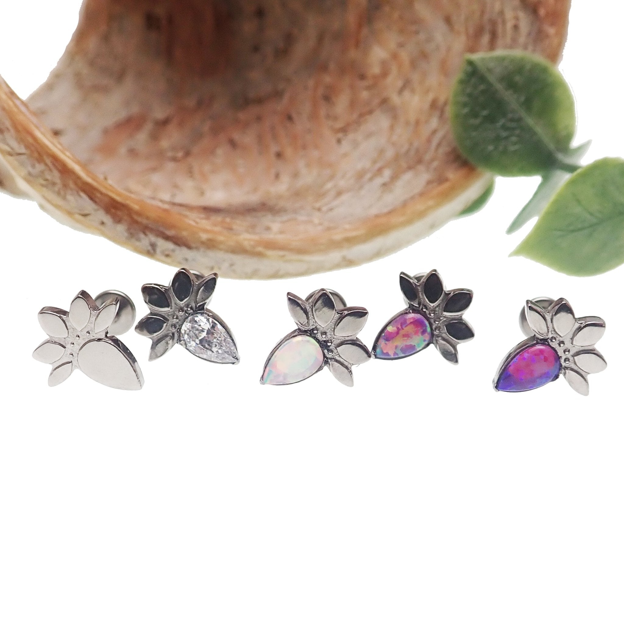 Lotus flower opal push fit labret body jewelry in various gauges by Body Clickers, featuring a 6mm opal lotus flower design.