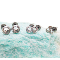 Pair of titanium zircon stone earrings with 3mm clear crystals, featuring sleek, modern design from Body Clickers Body Jewelry.