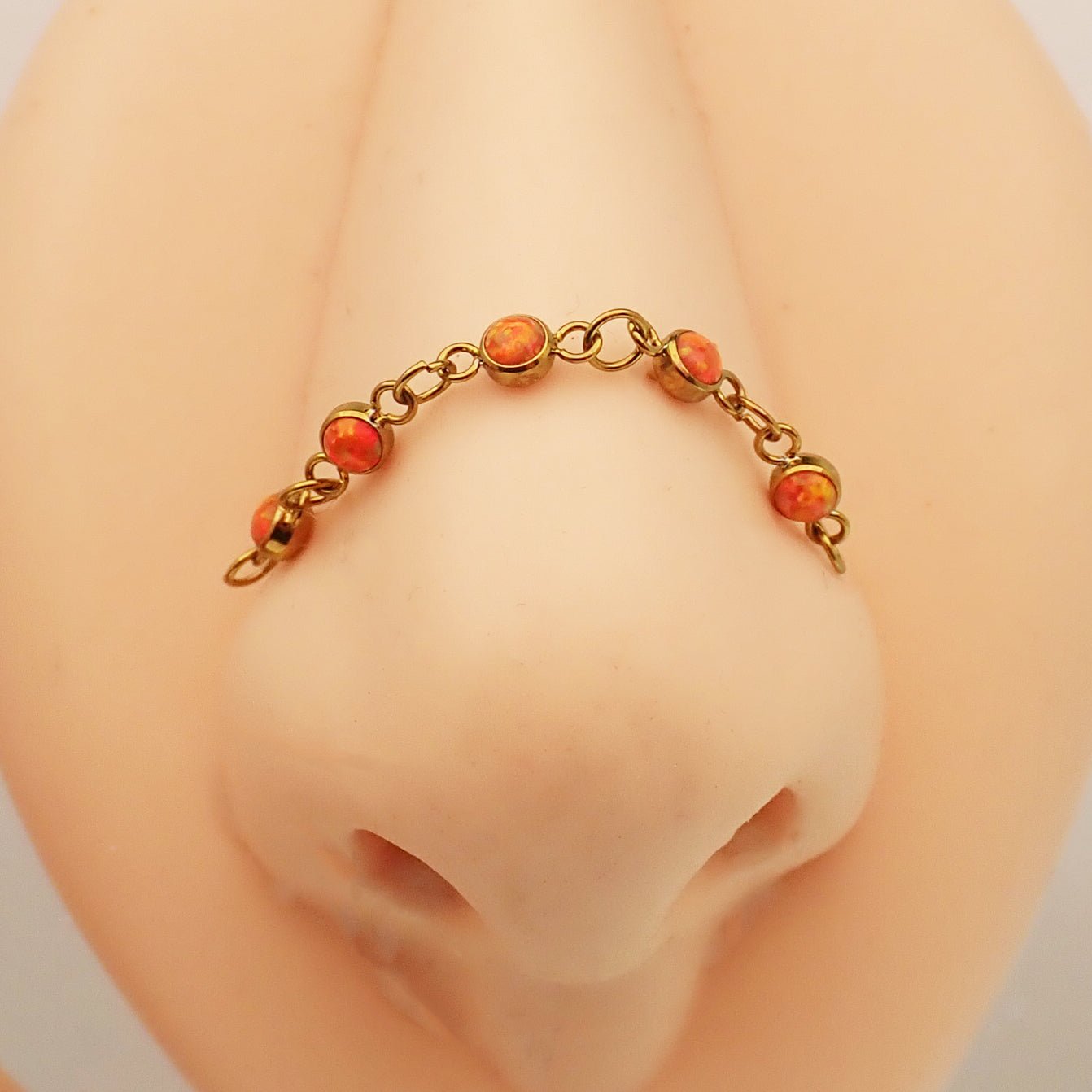 Peacock blue titanium opal piercing add-on chain for body jewelry by Body Clickers, showcasing vibrant gemstone and sleek titanium design.