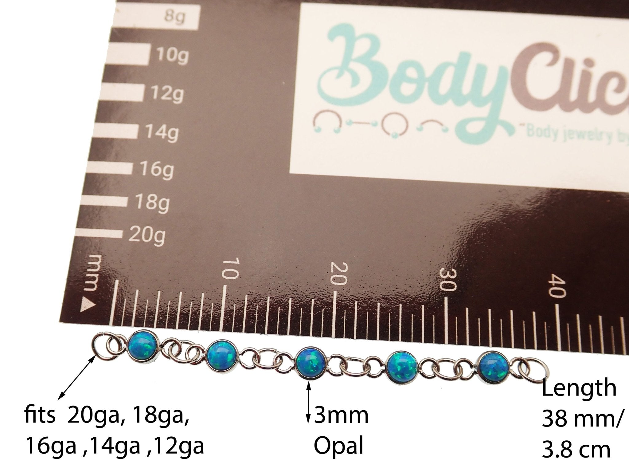 Peacock blue titanium opal body jewelry add-on chain by Body Clickers, designed for piercing enhancements.