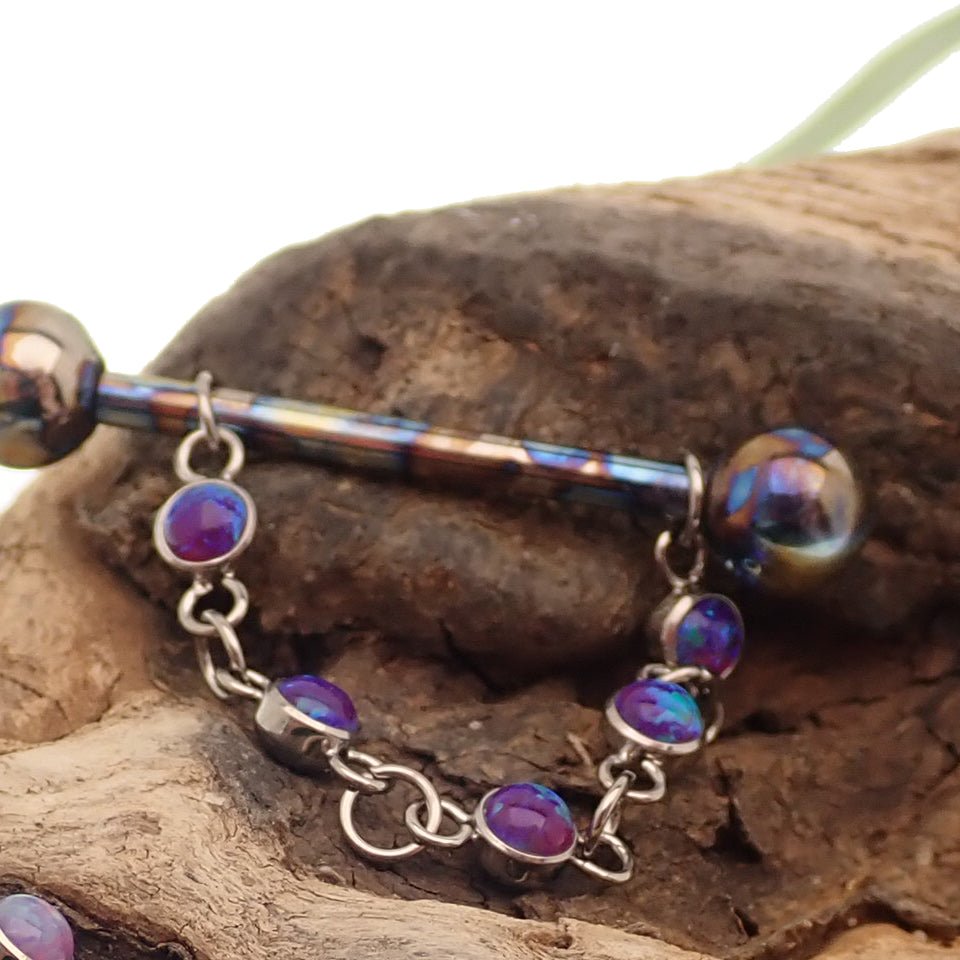 Titanium opal piercing add-on chain for body jewelry by Body Clickers, featuring peacock blue gemstone and intricate design.