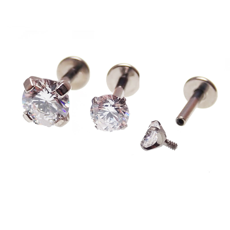 Clear triple CZ flat back body jewelry in 14g, 16g, or 18g by Body Clickers, shown in a close-up image.