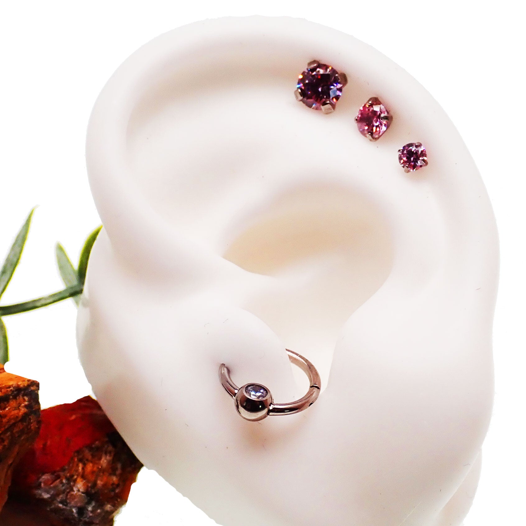 Set of three Body Clickers pink triple CZ flat back body jewelry in 14g, 16g, and 18g sizes with 6mm stones.