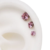 Set of three Body Clickers pink body jewelry with triple CZ flat back in 14g, 16g, and 18g sizes for body piercing.