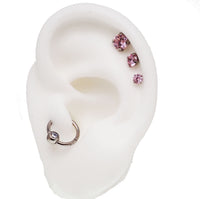 Set of three Body Clickers pink triple CZ flat back body jewelry in 14g, 16g, and 18g with 6mm stones, for body piercing.