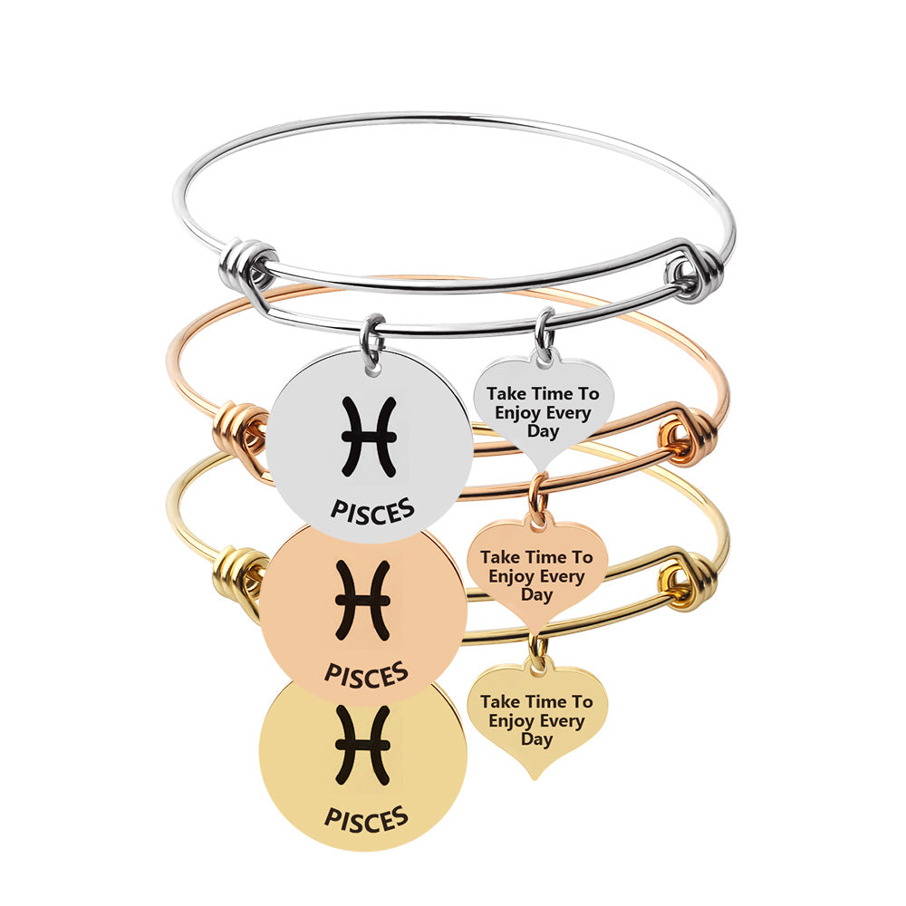 Silver Capricorn steel zodiac bangle by Body Clickers Body Jewelry, featuring a sleek design and celestial zodiac symbols.