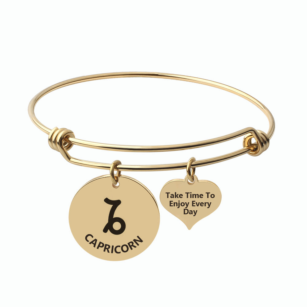 Silver Steel Capricorn Zodiac Bangle by Body Clickers Body Jewelry, featuring a sleek design with Capricorn symbol and polished finish.