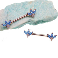 Blue and clear cubic zirconia rose gold flower steel nipple bar, 14g body jewelry with intricate floral design.