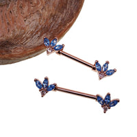 Blue and clear CZ flower steel nipple bar in rose gold, 14g body jewelry with intricate floral design.