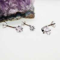 Star and square crystal steel body jewelry by Body Clickers, curved 16g body piercing with shiny star and square accents.