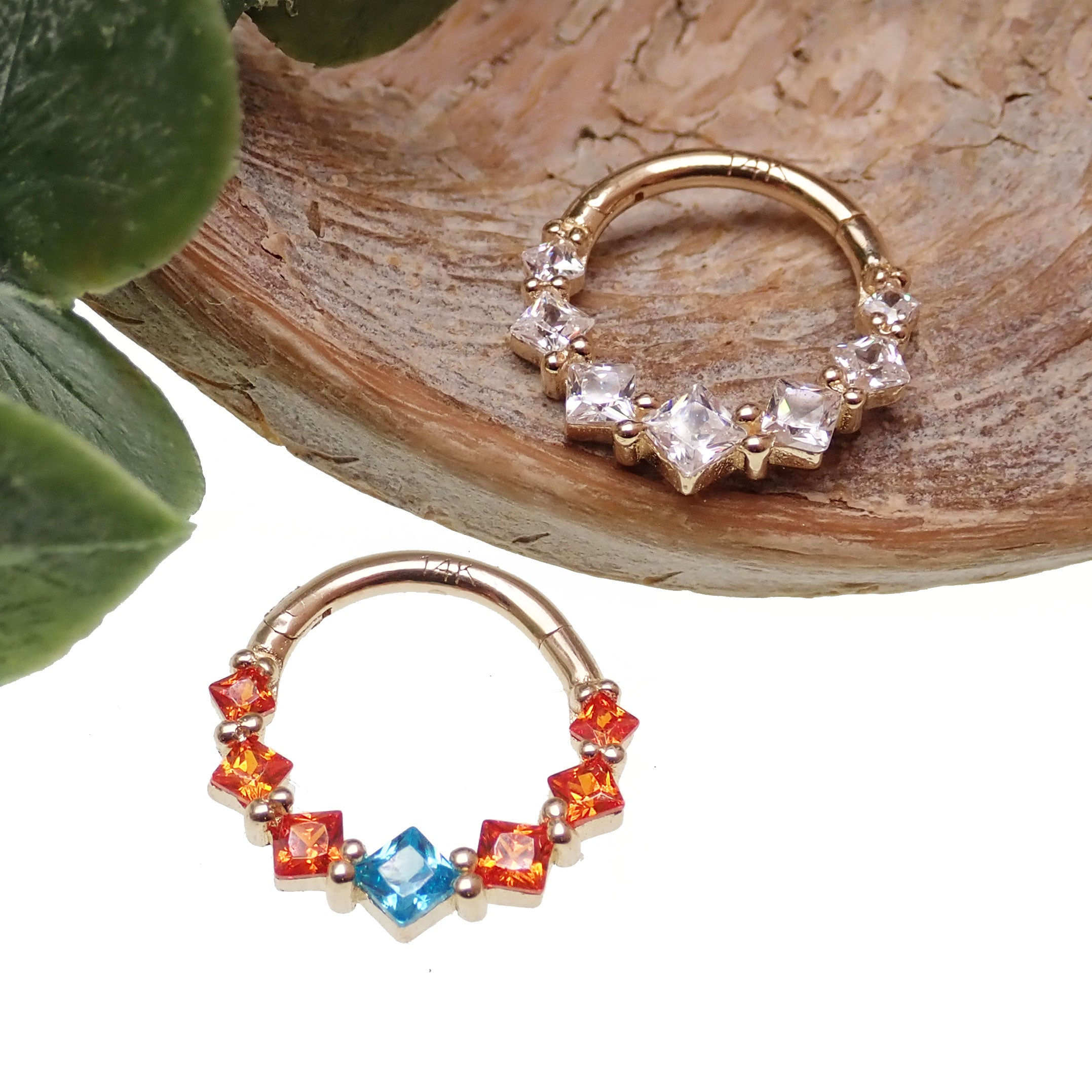 Teal and orange hinged clicker body jewelry with 14k gold and CZ stones, 16g, by Body Clickers, showcasing intricate design and sparkle.