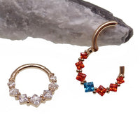 Hinged 14k gold body jewelry clicker with CZ stones in teal and orange, 16 gauge, by Body Clickers.