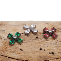 Titanium CZ cross flower flatback piercing in 14g, 16g, or 18g with decorative flower and cross design, Body Clickers brand.