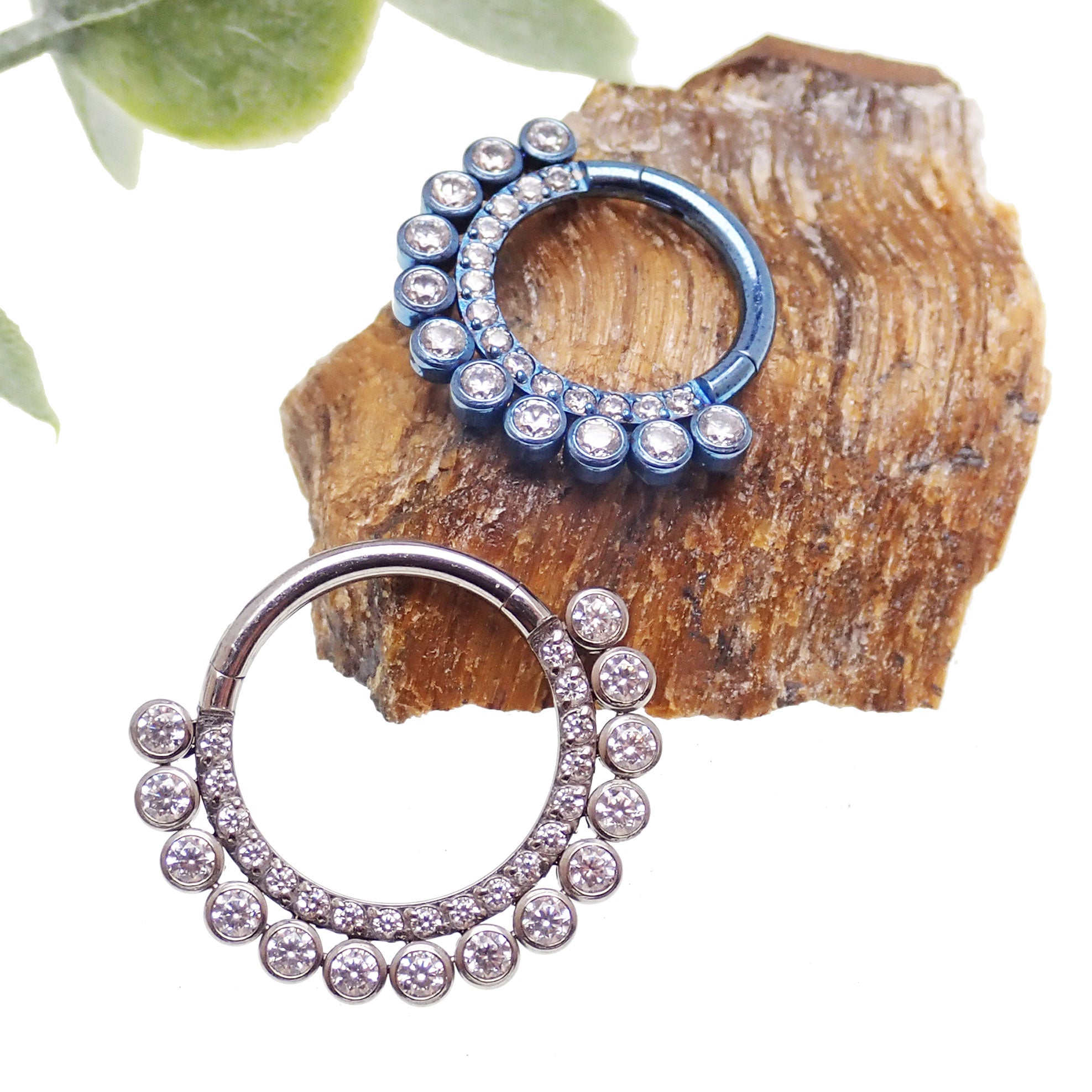 Double-row clear CZ stone titanium clicker earring in 16g with 8mm diameter, by Body Clickers, showcasing sparkling stones and sleek design.