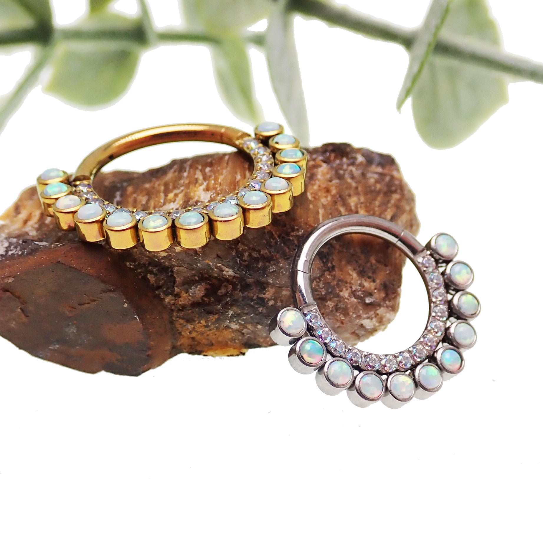 White opal and AB titanium 8mm clicker earring in 16g body jewelry with a sleek, modern design.