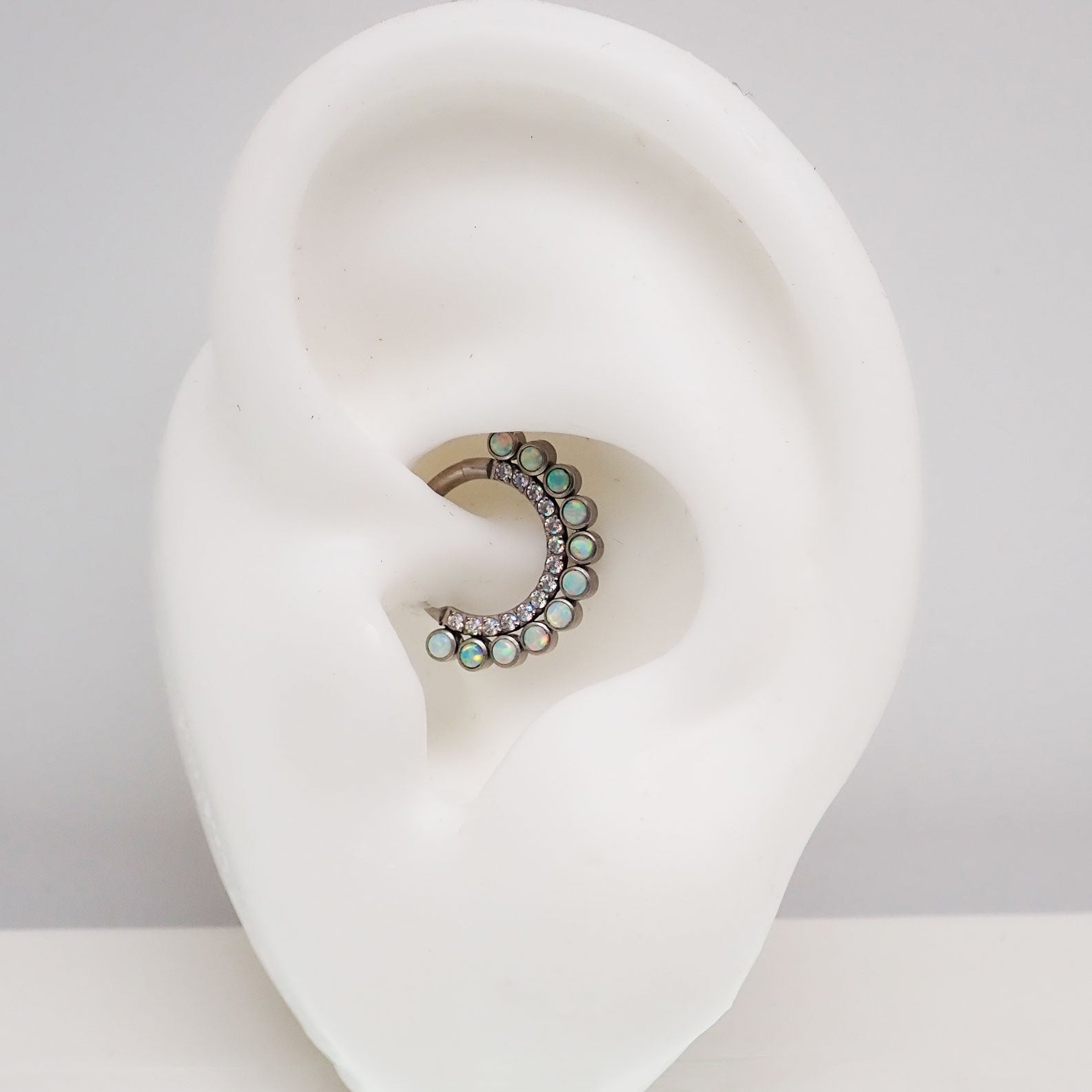 White opal and AB titanium clicker earring in 16g body jewelry with an 8mm diameter, by Body Clickers.
