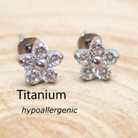 Titanium clear CZ flower earrings by Body Clickers, 20g implant jewelry with floral design and sparkling stones.