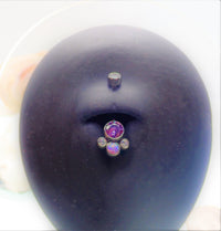 Titanium belly ring with opal and Swarovski crystals, featuring a sleek design from Body Clickers.