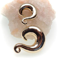 Pair of brass gold dipped ear weights from Body Clickers, 6mm size, designed for stretched ear piercings, displayed on a plain background.