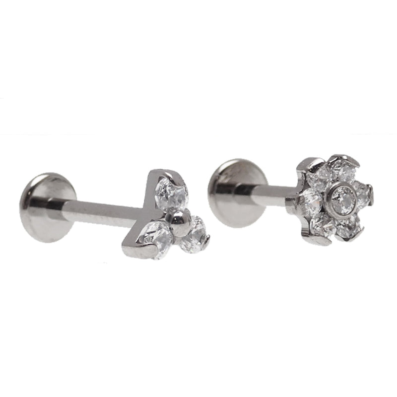 Two-piece set of clear CZ Trinity and flower titanium flatback earrings in 14g, 16g, and 18g for piercings.