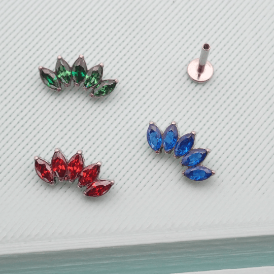 Colorful CZ Lotus Titanium flatback earrings in blue, red, and green with 14g, 16g, and 18g sizes by Body Clickers.