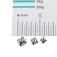 Pair of clear CZ crystal push-fit titanium earrings in 14g to 20g, featuring small 2.5mm gemstones and modern design.