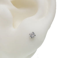 Pair of clear CZ crystal push fit titanium earrings in 14g to 20g, featuring small gemstone accents and sleek design.