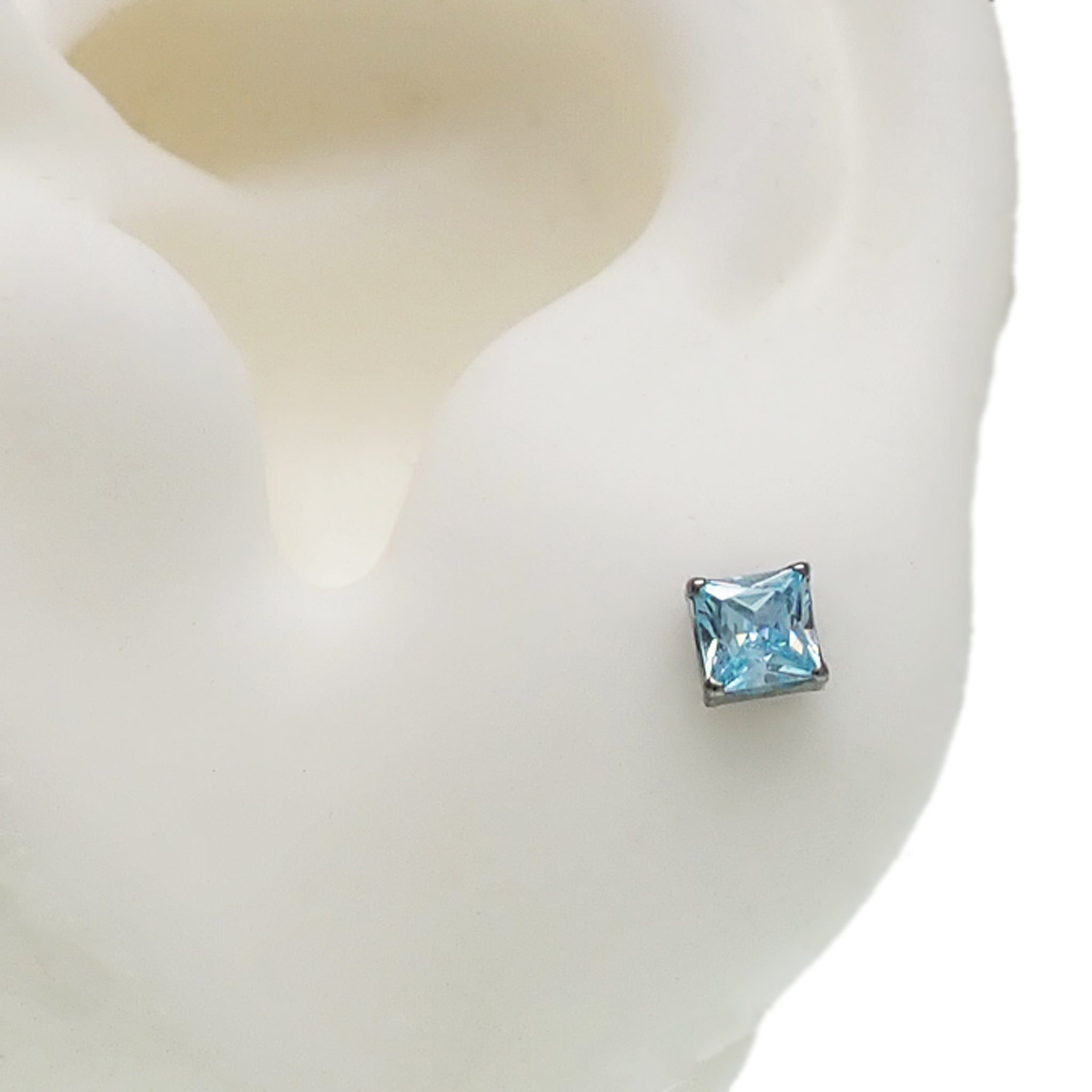 Pair of Body Clickers square CZ titanium earrings featuring amethyst stones, stylish and lightweight jewelry for pierced ears.