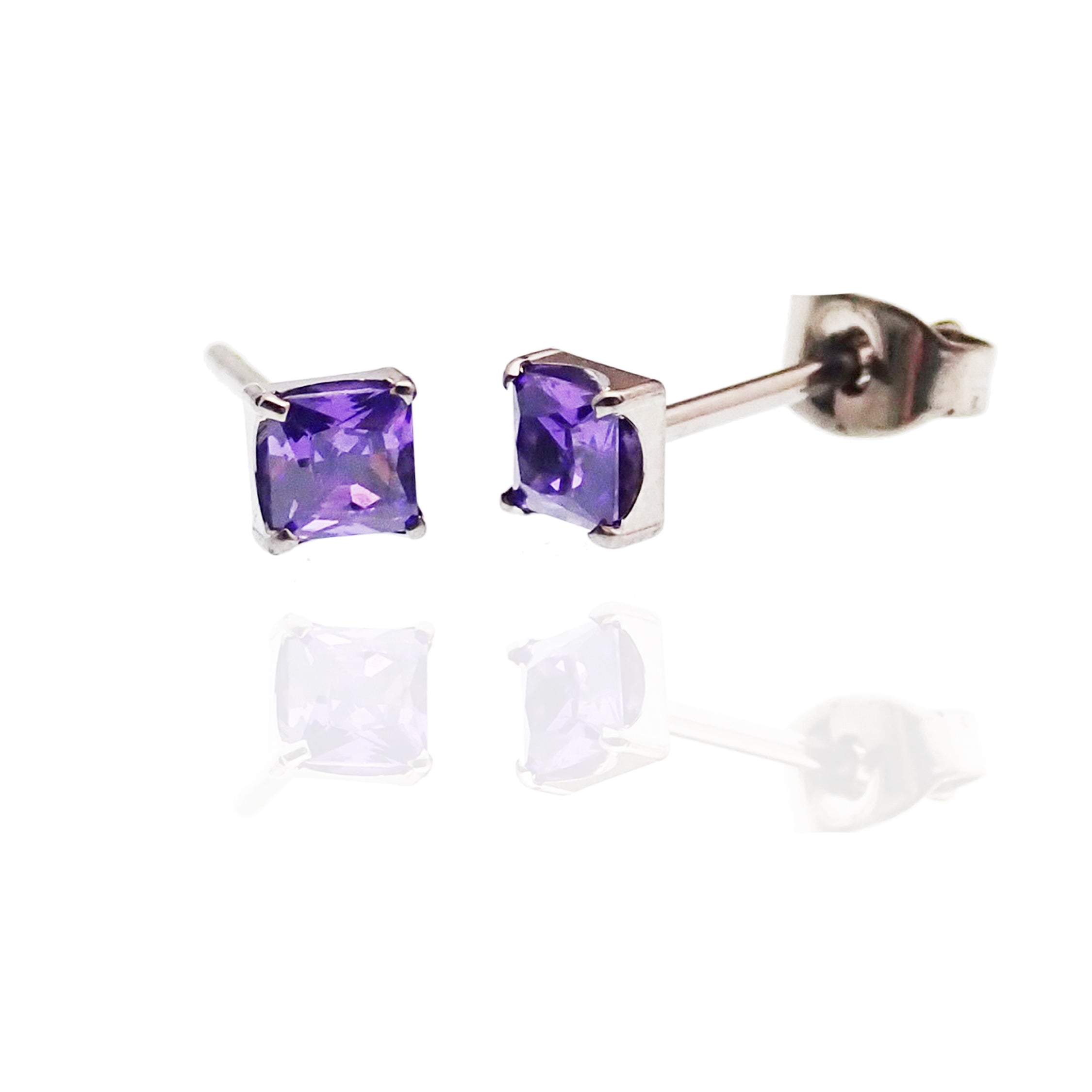 Pair of Square CZ Titanium Earrings by Body Clickers featuring purple amethyst accents and sleek modern design.