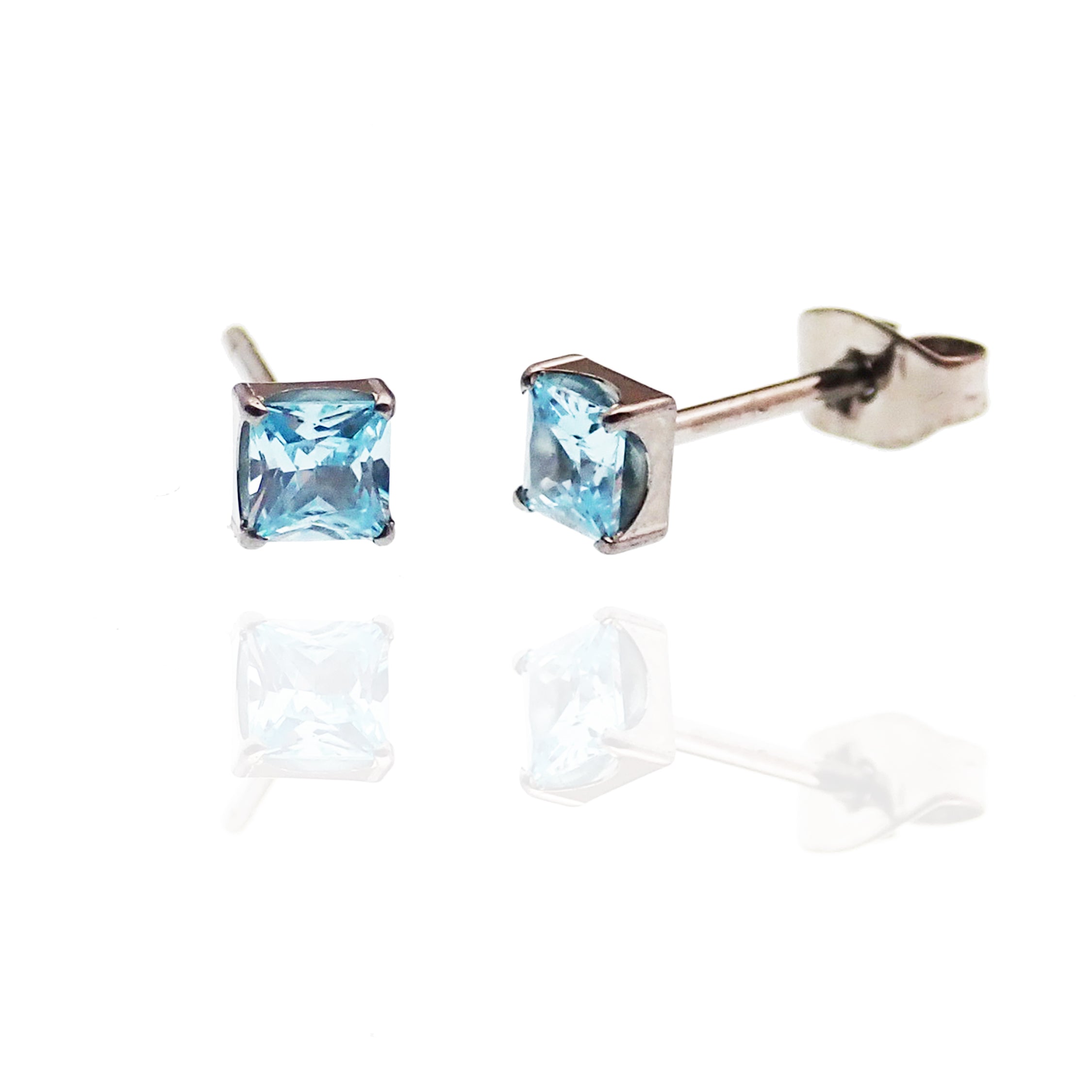 Pair of Body Clickers square CZ titanium earrings with amethyst accents, showcasing a sleek, modern jewelry design.