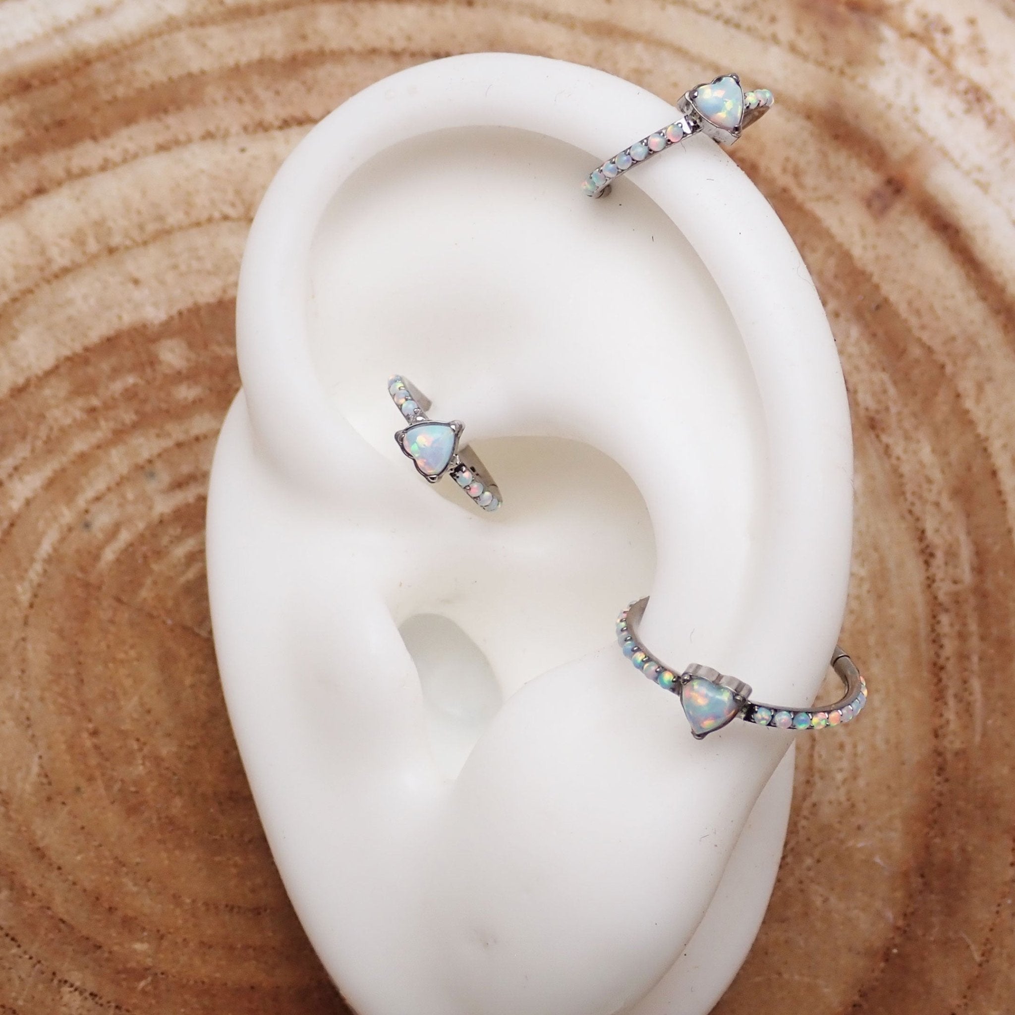 Titanium Heart Opal Hinged Clicker earring in 16g, from Body Clickers, featuring a heart-shaped opal gemstone and secure clasp.