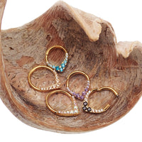 Gold titanium hinged clicker jewelry for septum or daith piercings, 16g, by Body Clickers with CZ PVD coating.