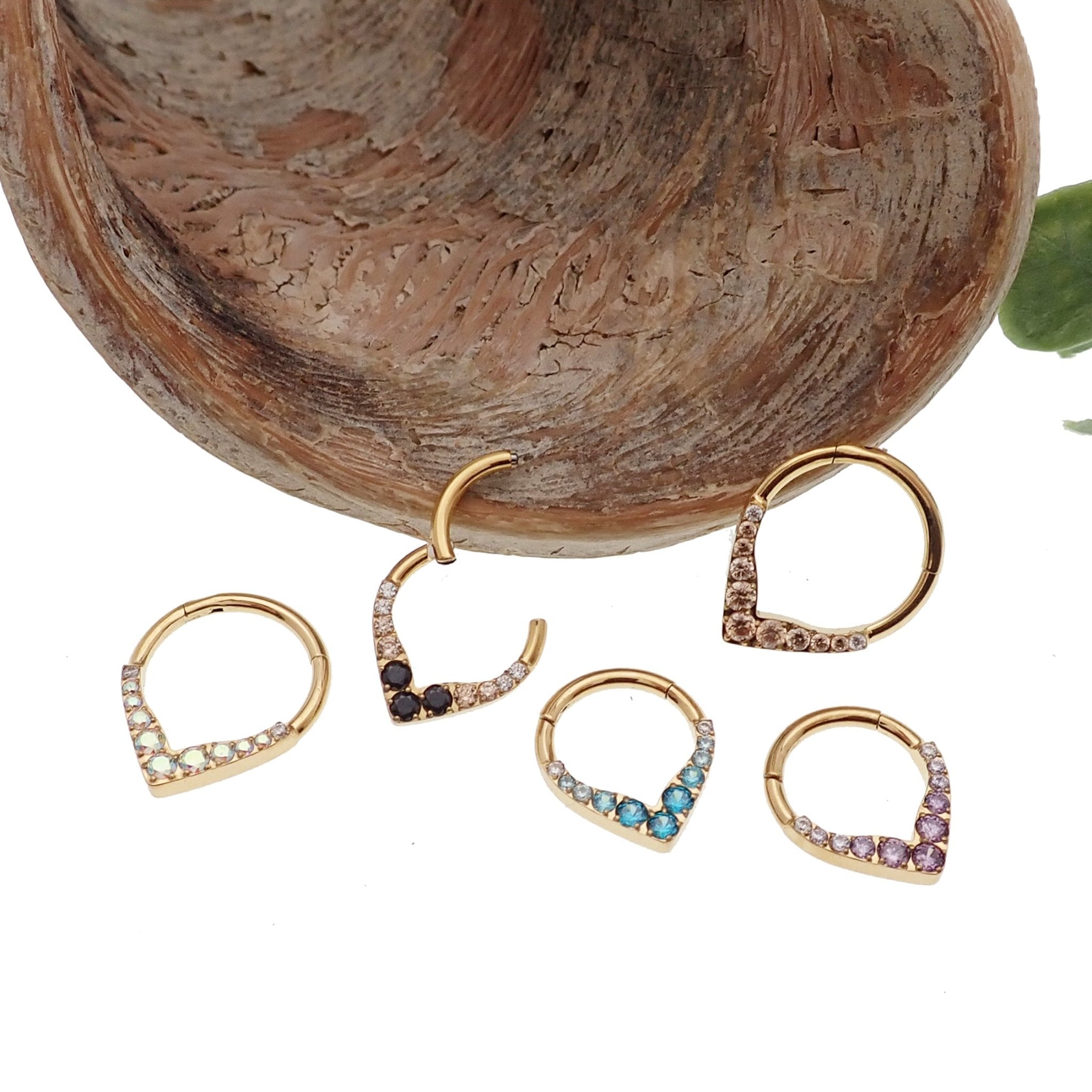 Gold titanium hinged clicker earring in 16g with CZ stones, by Body Clickers, featuring a sleek, modern design.