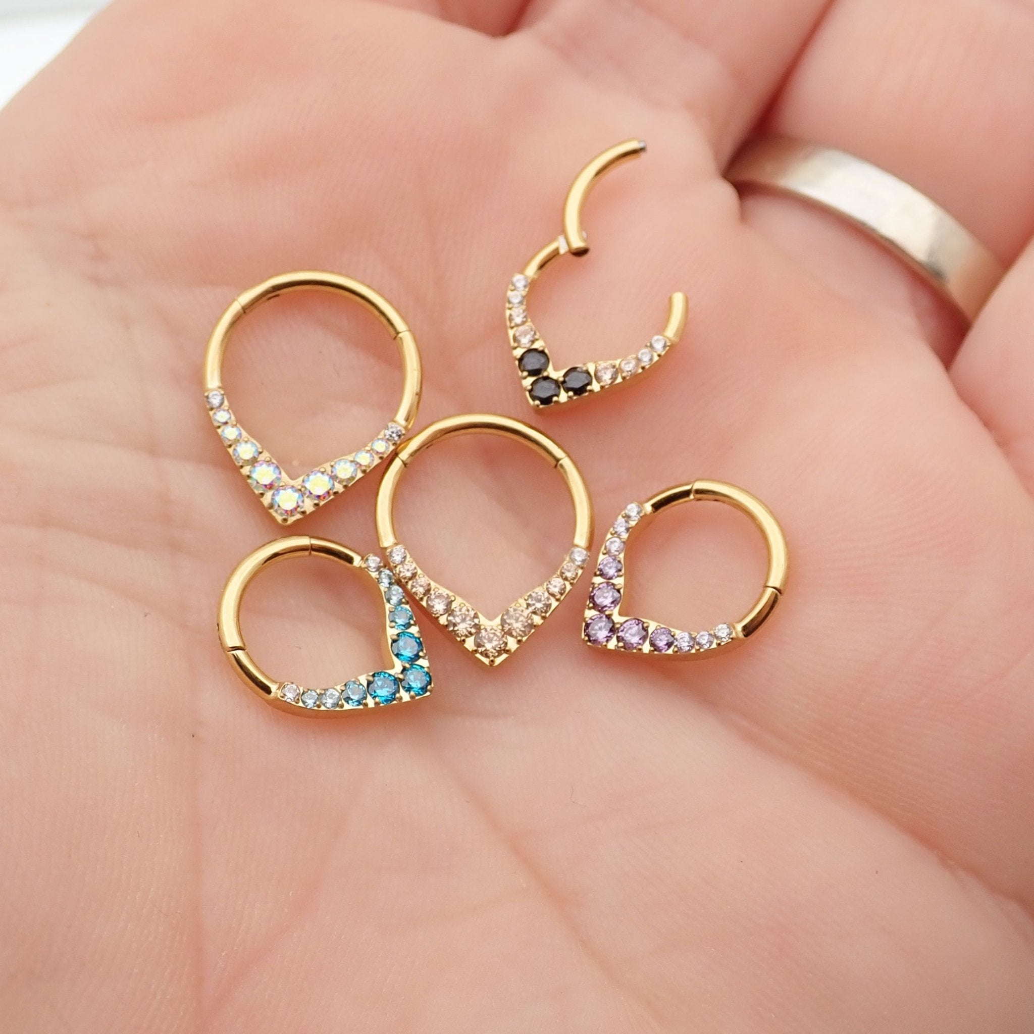Gold titanium hinged clicker earring with 16g gauge, designed for septum and daith piercings from Body Clickers.