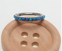 Hinged blue opal inlaid 6mm clicker earring by Body Clickers, 16g, shown with open clasp and polished metal finish.
