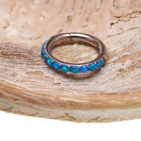 Hinged blue opal inlaid 6mm clicker earring by Body Clickers, 16g, with polished metal and vibrant opal details.