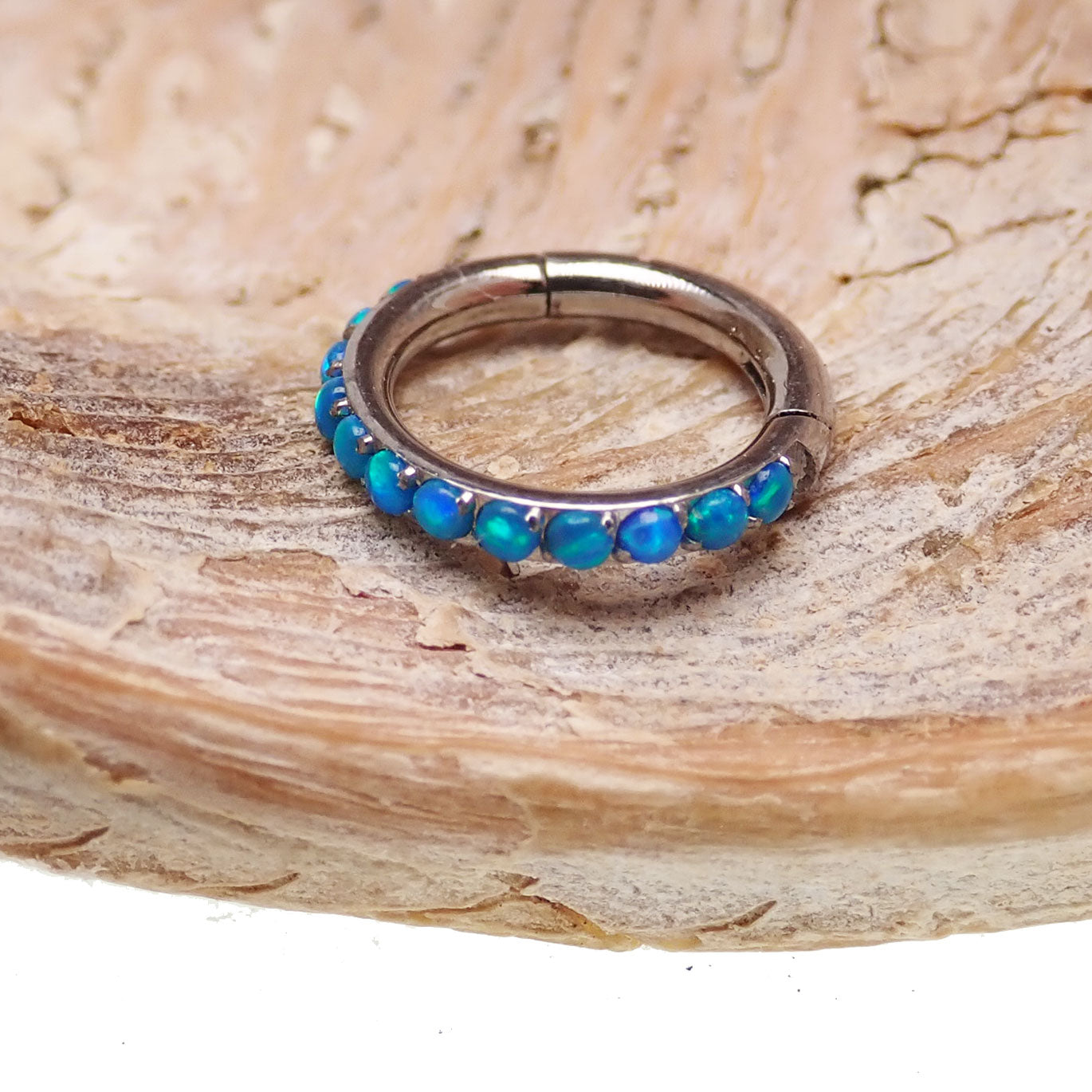 Hinged blue opal inlaid 6mm clicker earring by Body Clickers, 16g, with polished metal and vibrant opal details.