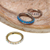 Blue opal inlaid 6mm hinged clicker earrings by Body Clickers, 16g body jewelry with a sleek design.