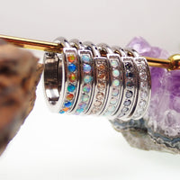Huggie-style 10mm titanium hinged clicker with bubblegum opal design, 16g body jewelry from Body Clickers.